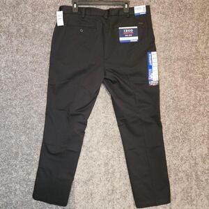 Men's Izod Chino flat front black dress pants. 38x32 NWT